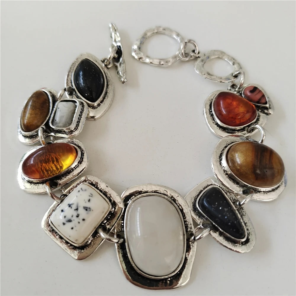 Bracelet vintage en argent vieilli 925 avec pierres précieuses incrustées.