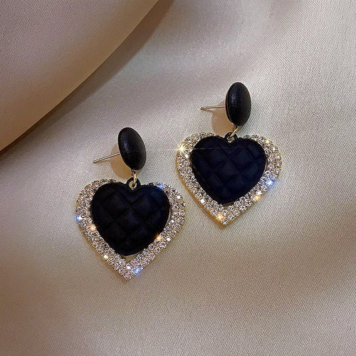 Boucles d'oreilles noires et dorées en forme de cœur