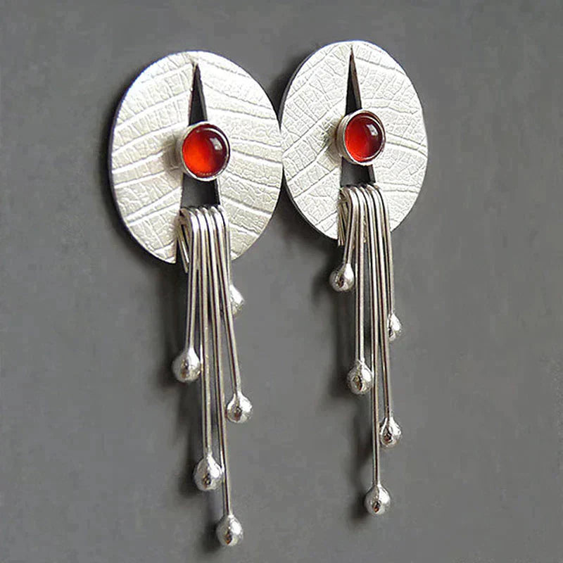 Boucles d'oreilles avec pendentif en pierre creuse rouge