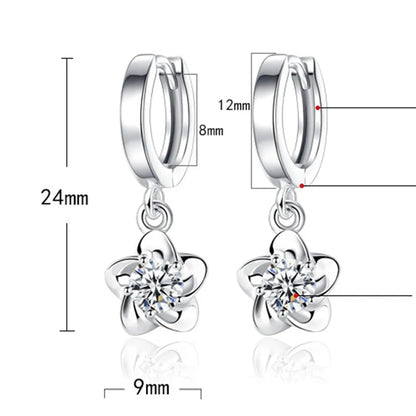 Boucles d'oreilles en argent avec des zircons violets et blancs