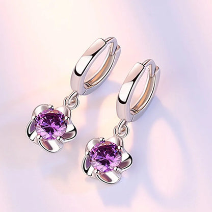 Boucles d'oreilles en argent avec des zircons violets et blancs