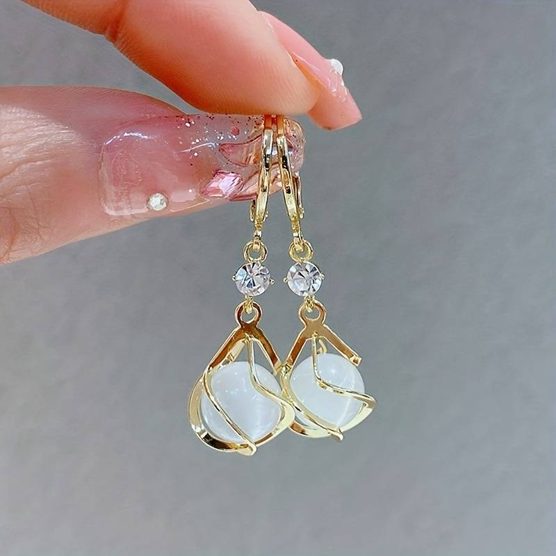 Célia™ | Boucles opale blanche dorées