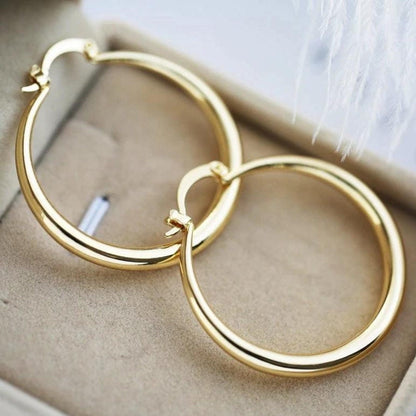 Boucles d'oreilles en or éclatant, larges et raffinées